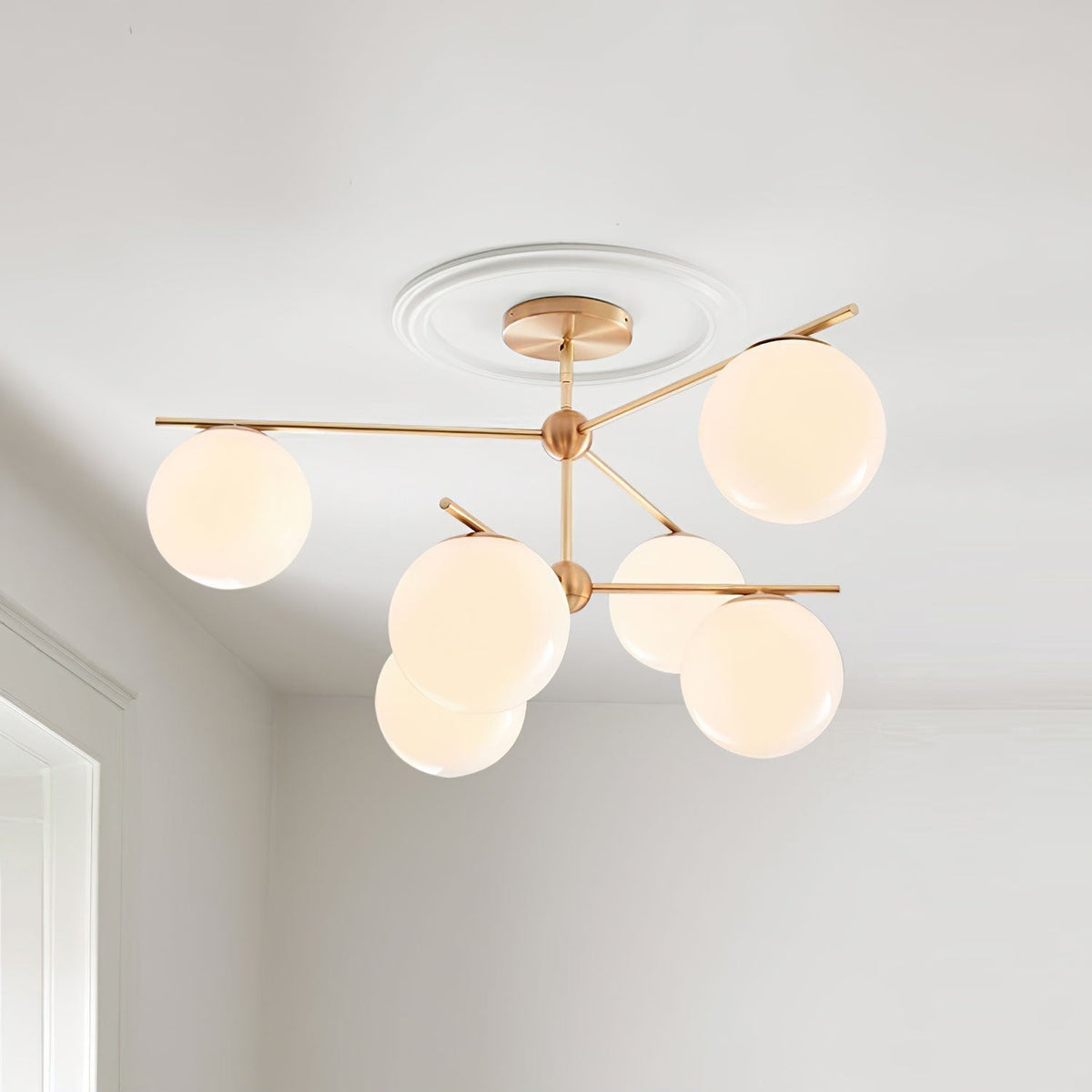 Casoella lámpara de araña esfera y tallo moderna dorada LED