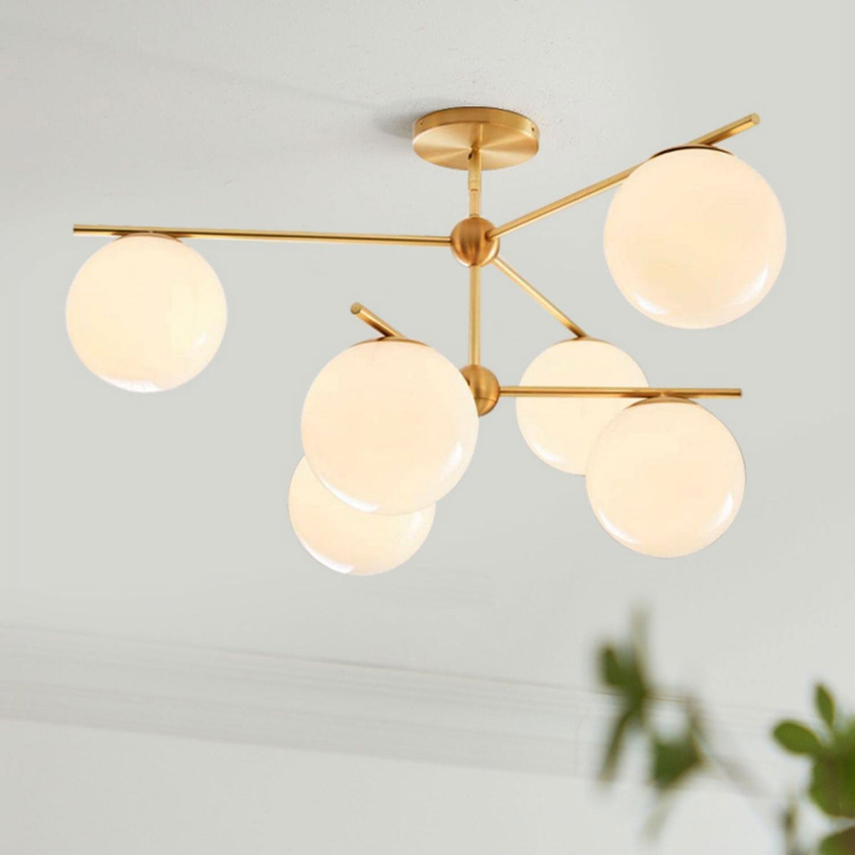 Casoella lámpara de araña esfera y tallo moderna dorada LED