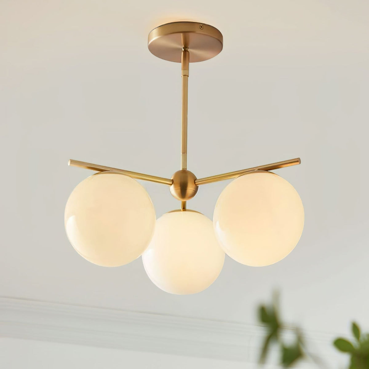 Casoella lámpara de araña esfera y tallo moderna dorada LED